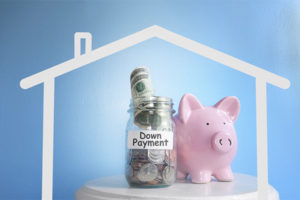 Piggy bank with money for down payment on a house