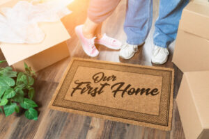 Doormat that says "Our First Home"