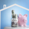 Piggy bank with money for down payment on a house